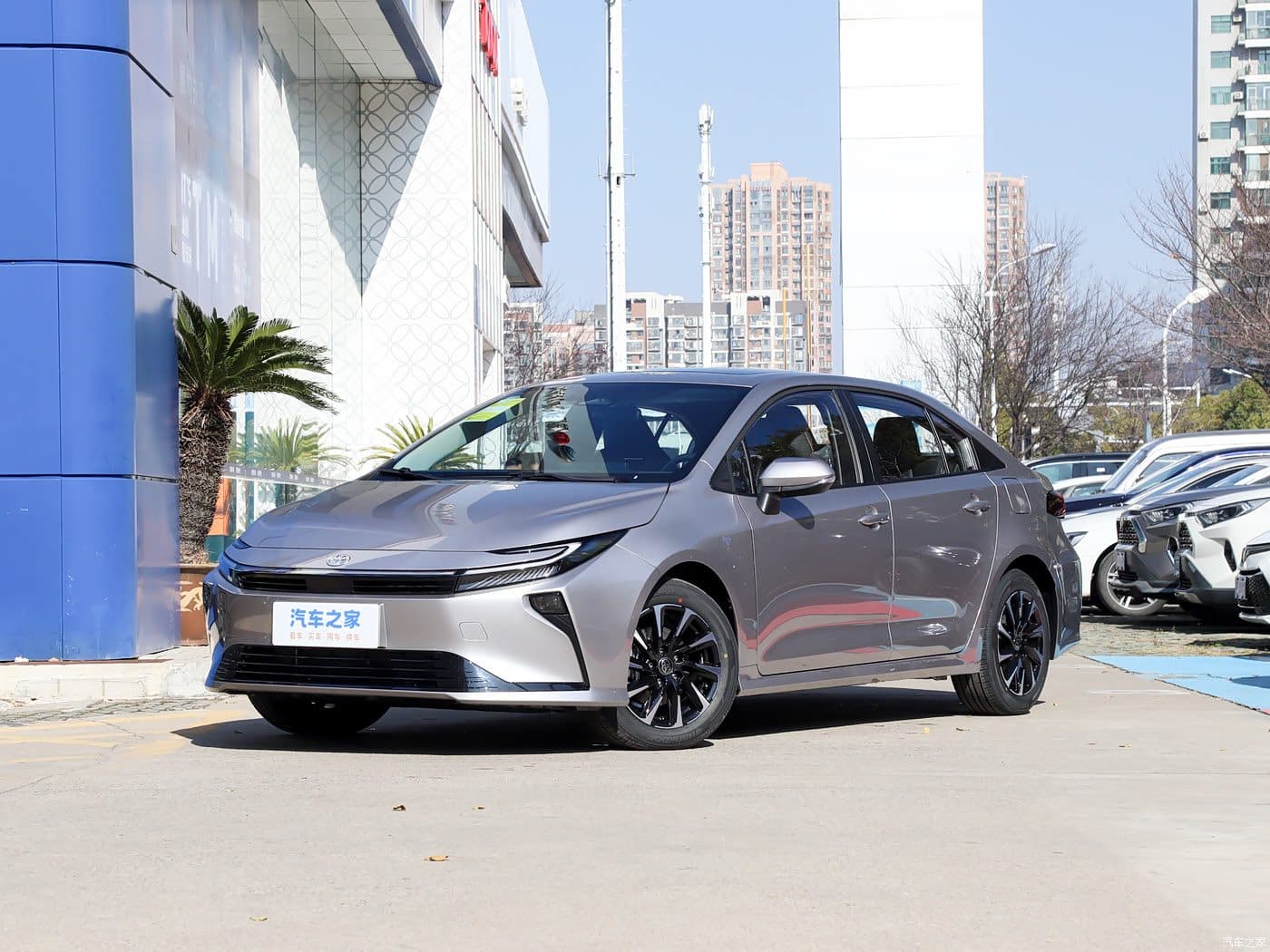 2026 Toyota Corolla 1.8L Hybrid in grey, front three-quarter view — compact sedan for export